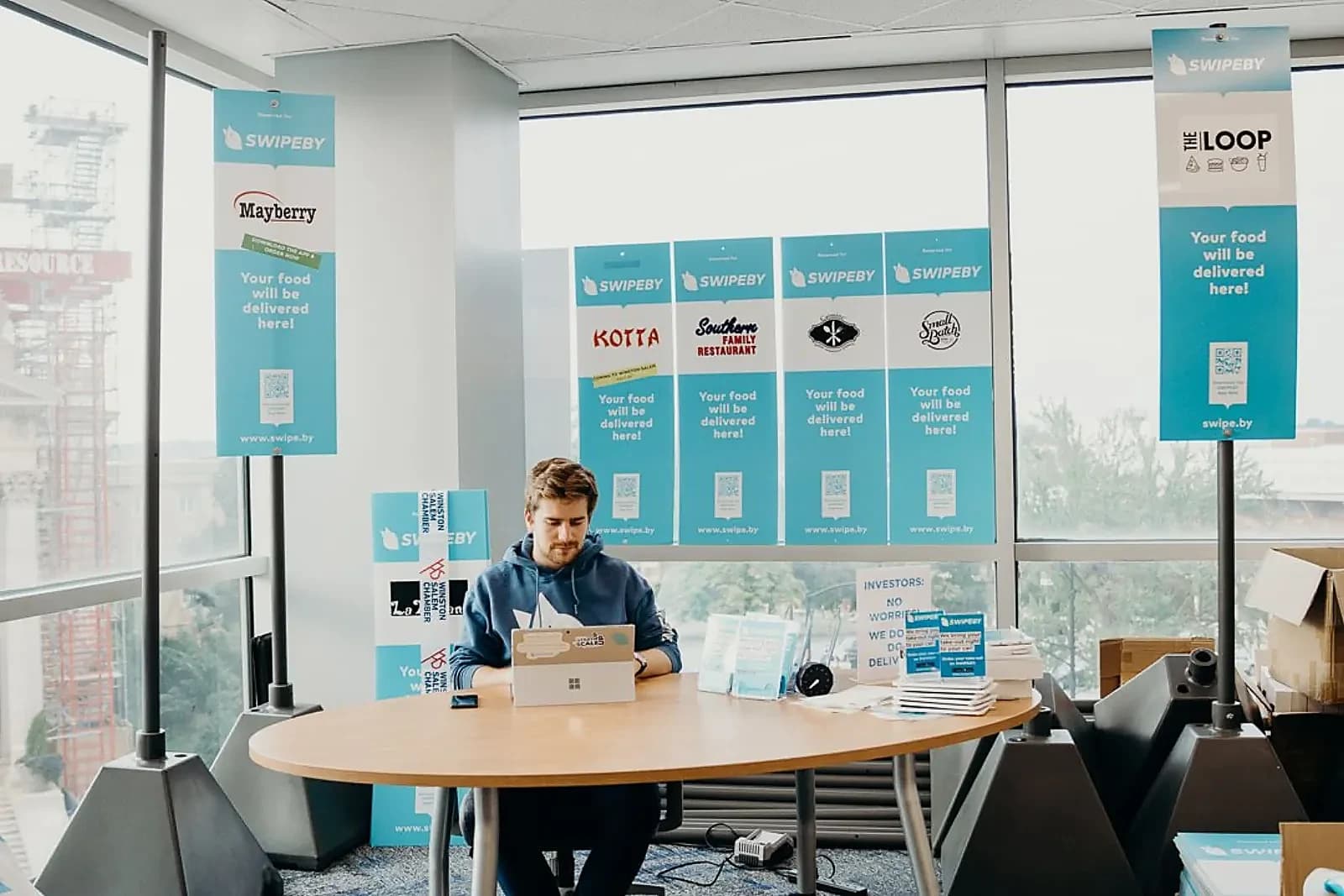 SWIPEBY founder working at one desk in Winston Starts incubator