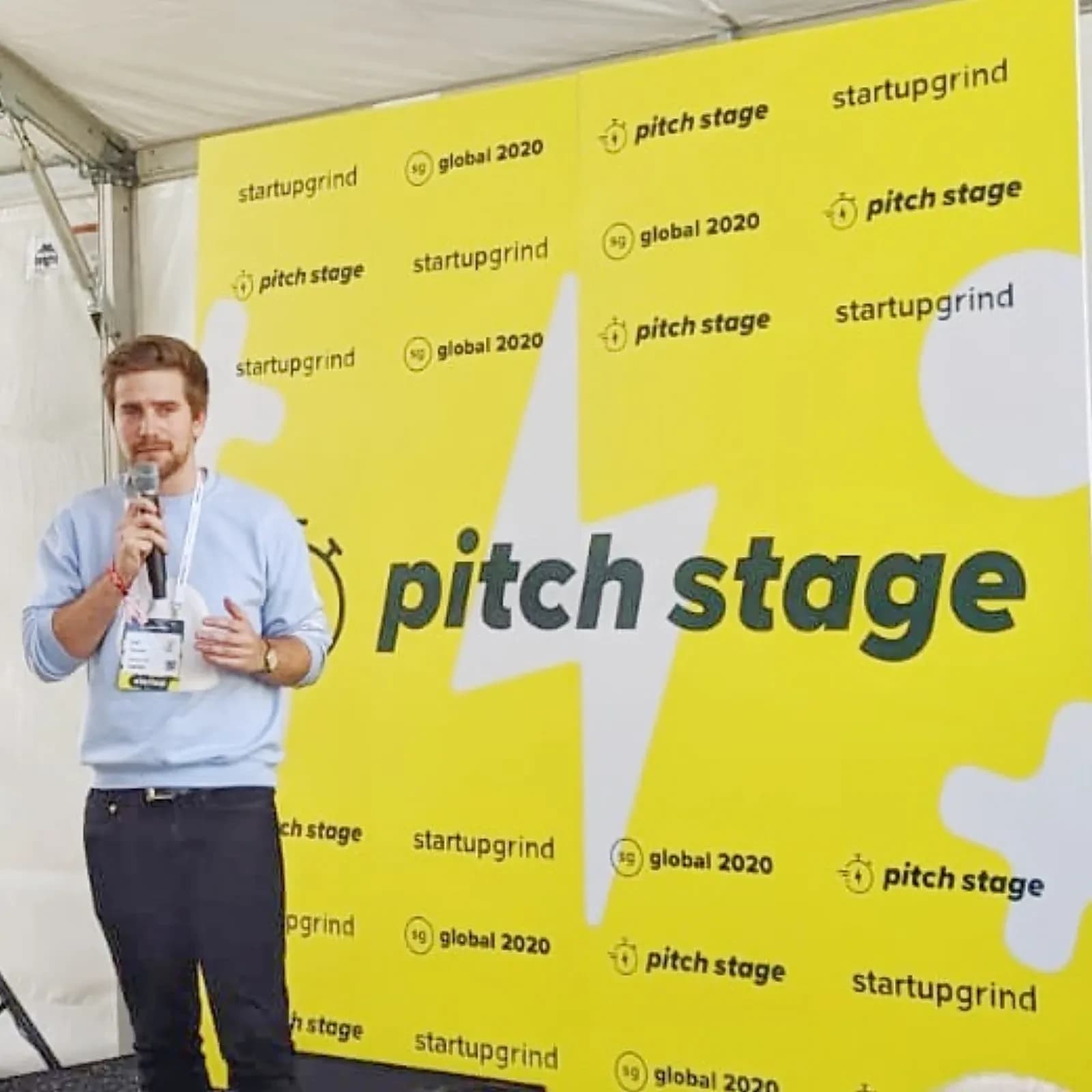 SWIPEBY founder at Startup Grind pitch stage